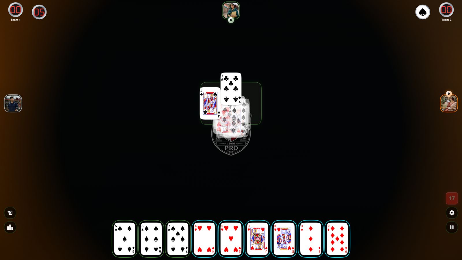 A live Kot Pees table mid-deal, with the pile of tricks building in the centre.